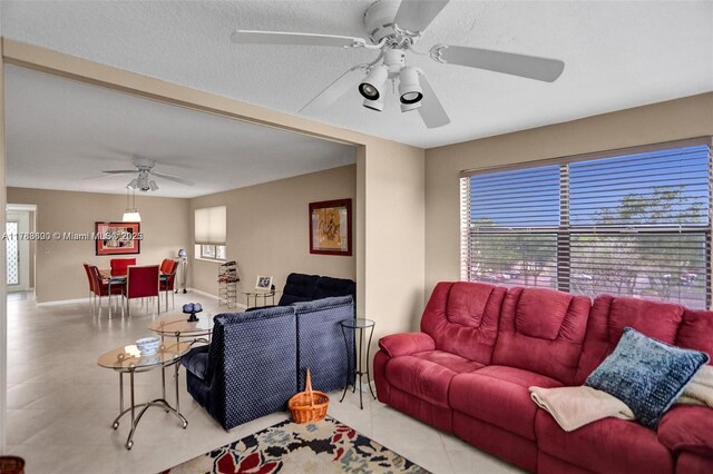 10451 Sunrise Lakes Blvd Unit 401, Sunrise, FL 33322 - living area with baseboards and a ceiling fan