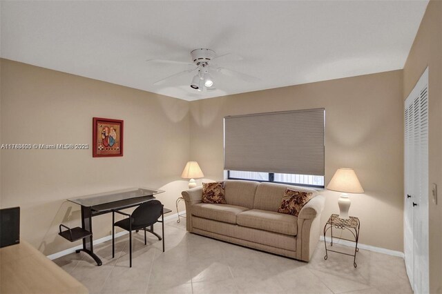 10451 Sunrise Lakes Blvd Unit 401, Sunrise, FL 33322 - living area with light tile patterned flooring, ceiling fan, and baseboards