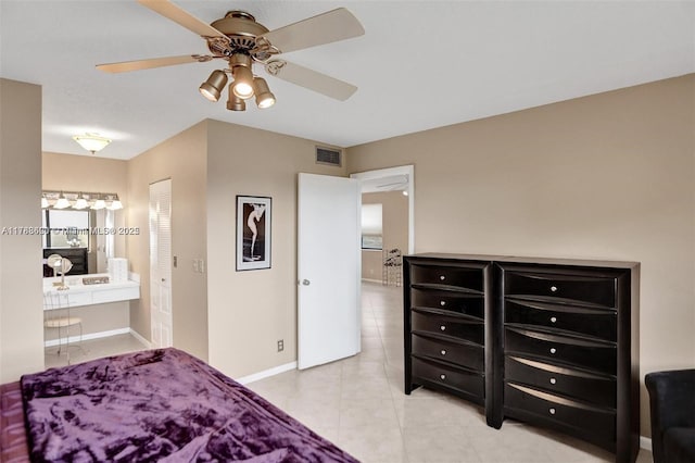 10451 Sunrise Lakes Blvd Unit 401, Sunrise, FL 33322 - bedroom with light tile patterned floors, ensuite bath, a ceiling fan, visible vents, and baseboards