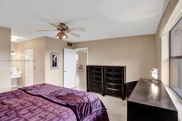 10451 Sunrise Lakes Blvd Unit 401, Sunrise, FL 33322 - bedroom featuring light tile patterned floors, visible vents, and a ceiling fan