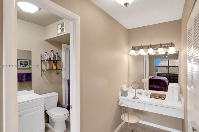 10451 Sunrise Lakes Blvd Unit 401, Sunrise, FL 33322 - full bathroom featuring toilet, vanity, and baseboards