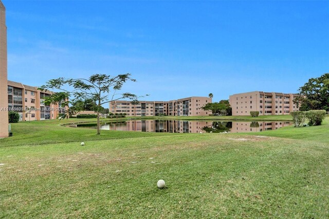 10451 Sunrise Lakes Blvd Unit 401, Sunrise, FL 33322 - view of property's community featuring a lawn and a water view