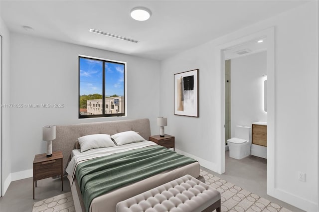 bedroom featuring ensuite bathroom, baseboards, and visible vents