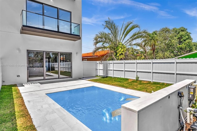view of pool featuring a patio and a fenced backyard