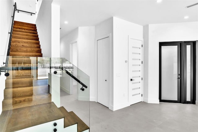 interior space with recessed lighting, visible vents, baseboards, and finished concrete flooring