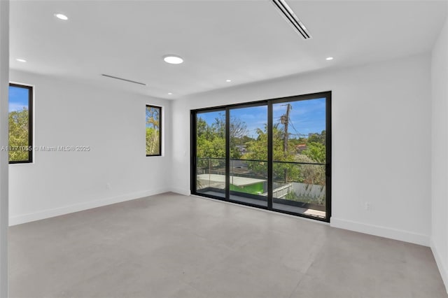 unfurnished room featuring recessed lighting, visible vents, and baseboards