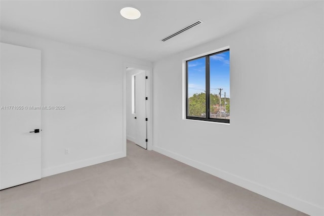 unfurnished room featuring visible vents, baseboards, and light colored carpet