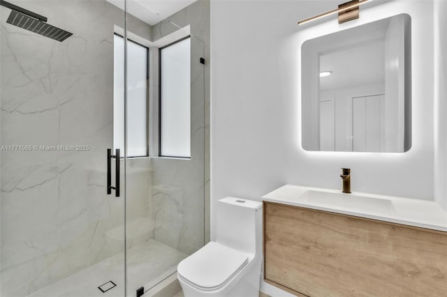 full bath with toilet, a marble finish shower, and vanity