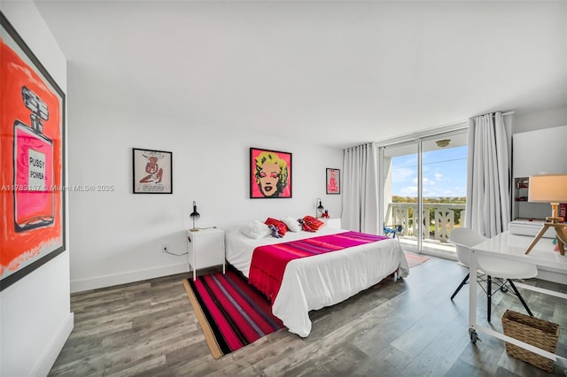8233 Harding Ave Unit 607, Miami Beach, FL 33141 - bedroom featuring access to exterior and wood finished floors