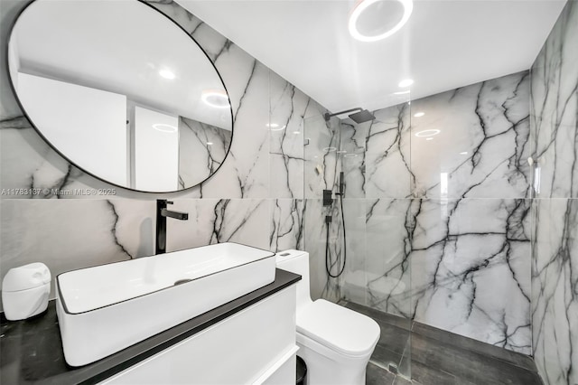 8233 Harding Ave Unit 607, Miami Beach, FL 33141 - bathroom featuring tile walls, a marble finish shower, and vanity