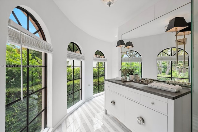 interior space featuring vanity and recessed lighting