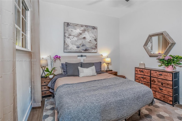 bedroom featuring wood finished floors