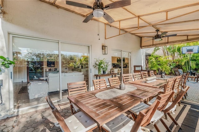 view of patio featuring a ceiling fan and outdoor dining area