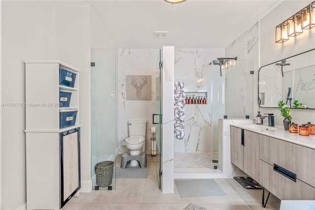 full bathroom featuring a marble finish shower, vanity, toilet, tile patterned flooring, and visible vents