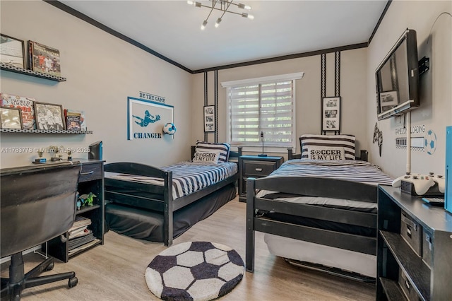 bedroom featuring wood finished floors and crown molding