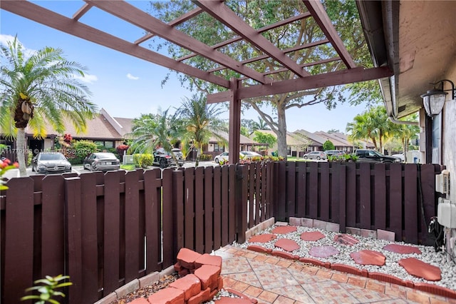 view of patio / terrace with fence, a residential view, and a pergola