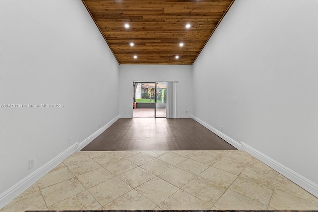 tiled spare room featuring wooden ceiling, baseboards, recessed lighting, and vaulted ceiling