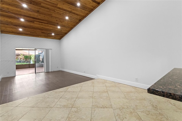 unfurnished room featuring recessed lighting, tile patterned floors, wooden ceiling, baseboards, and high vaulted ceiling