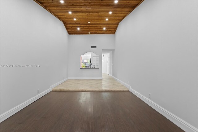 interior space featuring recessed lighting, baseboards, wooden ceiling, and wood finished floors