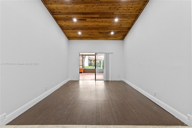 spare room with baseboards, recessed lighting, lofted ceiling, wood finished floors, and wood ceiling