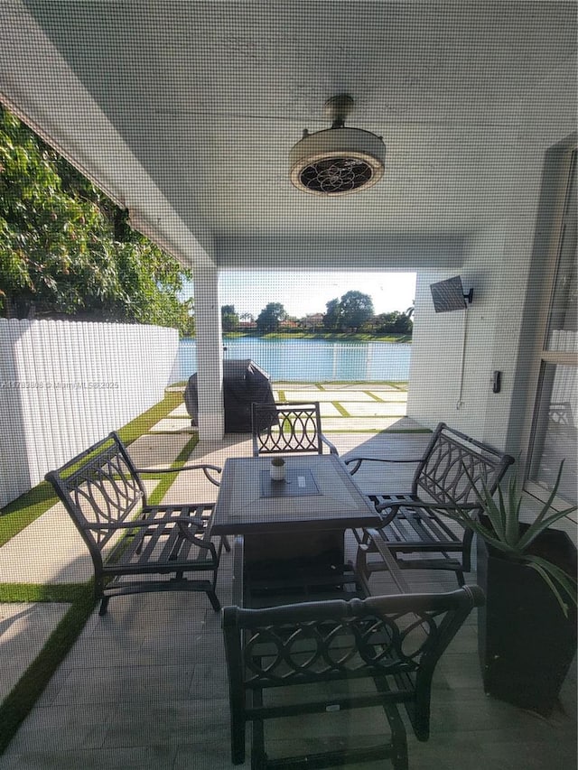 3708 NE 22nd Pl, Homestead, FL 33033 - view of patio / terrace featuring a water view, outdoor dining area, and fence