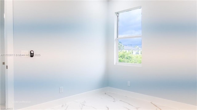 2901 27th St SW, Lehigh Acres, FL 33976 - spare room featuring baseboards and marble finish floor