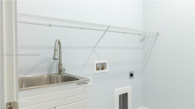 2901 27th St SW, Lehigh Acres, FL 33976 - laundry area with a sink, hookup for an electric dryer, laundry area, and washer hookup