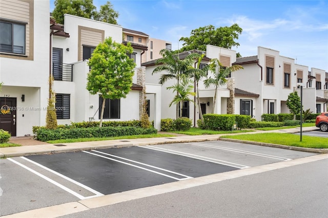 340 NE 208th Ter, Miami, FL 33179 - view of building exterior featuring a residential view and uncovered parking