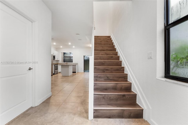 340 NE 208th Ter, Miami, FL 33179 - stairs featuring recessed lighting and tile patterned flooring