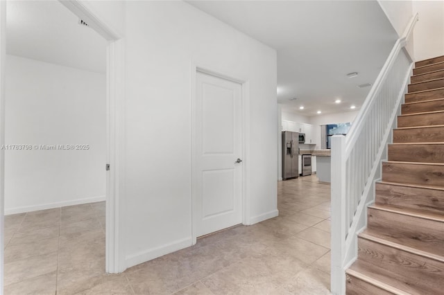 340 NE 208th Ter, Miami, FL 33179 - staircase featuring tile patterned flooring and recessed lighting