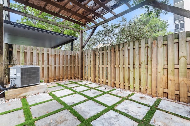 340 NE 208th Ter, Miami, FL 33179 - view of patio with a fenced backyard, a pergola, and central air condition unit