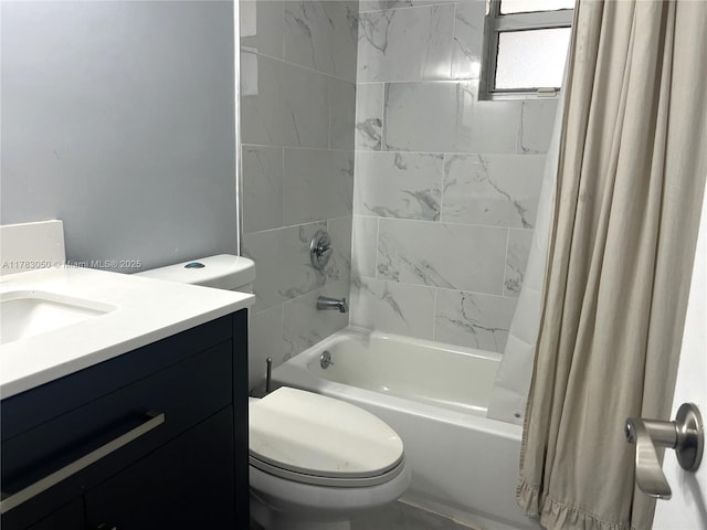 bathroom featuring shower / bathtub combination with curtain, toilet, and vanity