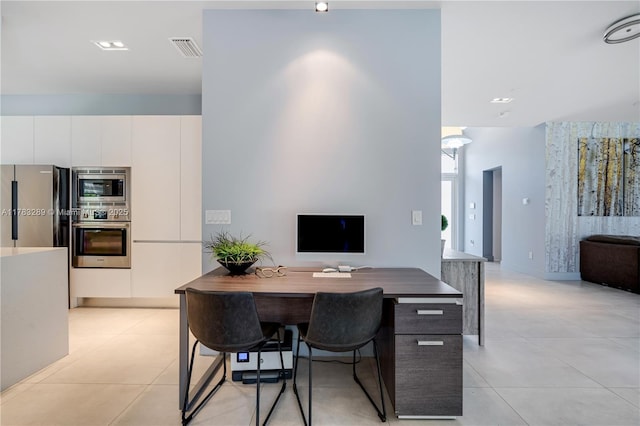 office space with light tile patterned floors and visible vents