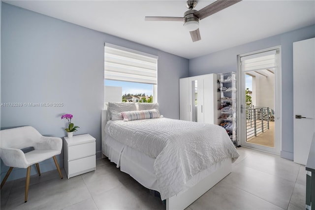 bedroom featuring access to exterior and a ceiling fan