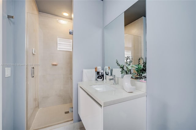 full bath with a shower stall and vanity