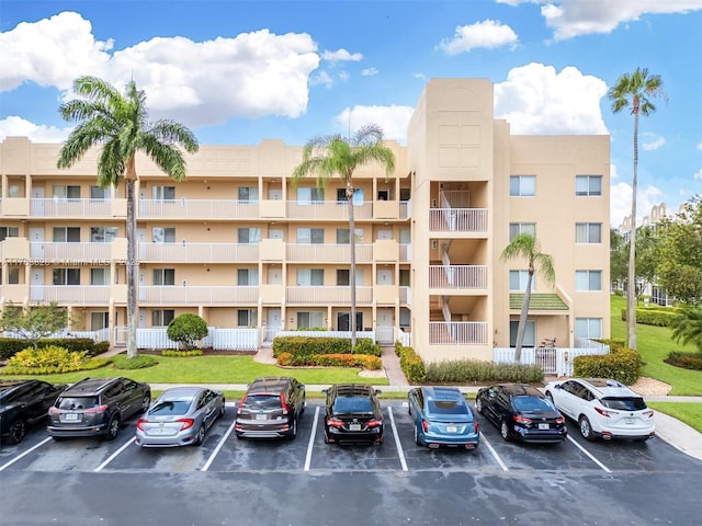 7751 Southampton Ter Unit 216, Tamarac, FL 33321 - view of apartment building / complex featuring uncovered parking