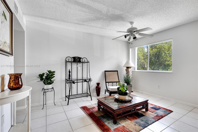 7751 Southampton Ter Unit 216, Tamarac, FL 33321 - sitting room with a ceiling fan, light tile patterned floors, and a textured ceiling