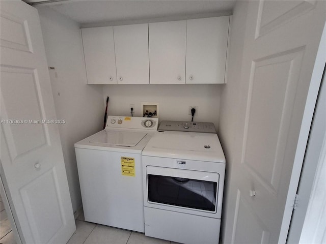 7751 Southampton Ter Unit 216, Tamarac, FL 33321 - laundry area featuring cabinet space, independent washer and dryer, and light tile patterned floors