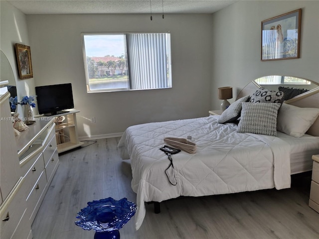 7751 Southampton Ter Unit 216, Tamarac, FL 33321 - bedroom with wood finished floors and baseboards