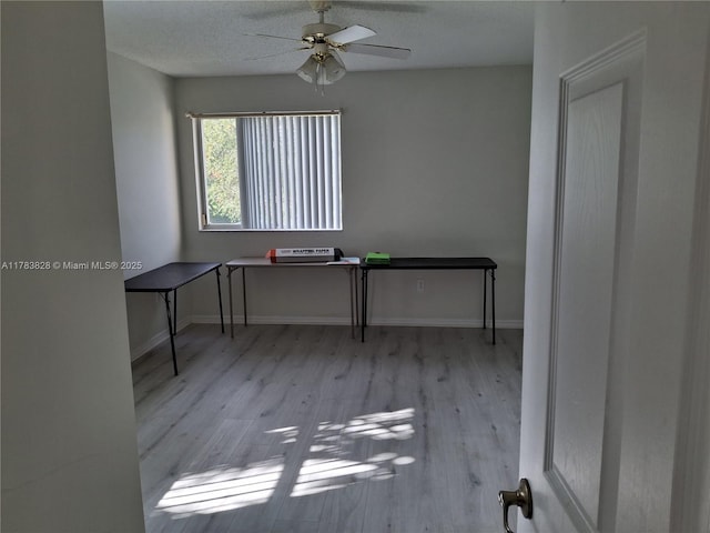 7751 Southampton Ter Unit 216, Tamarac, FL 33321 - unfurnished office featuring a ceiling fan, wood finished floors, and baseboards