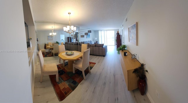 7751 Southampton Ter Unit 216, Tamarac, FL 33321 - dining room with a chandelier and light wood-style floors