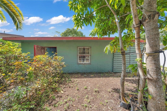 view of side of property with stucco siding