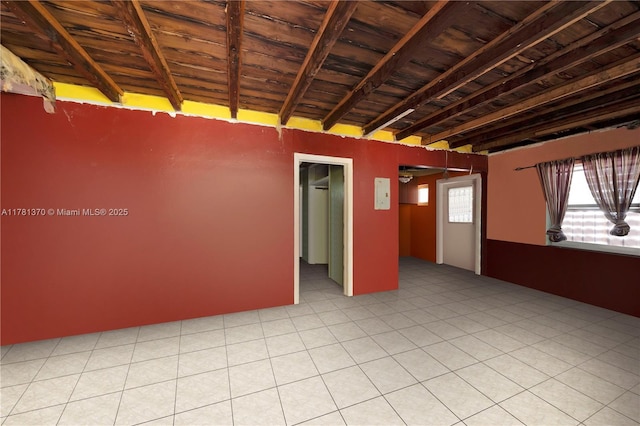 empty room with wooden ceiling and beam ceiling