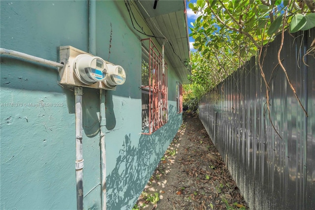 view of side of property with fence