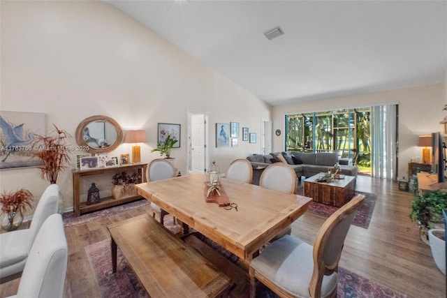 9909 NW 52nd Ln, Doral, FL 33178 - dining room with wood finished floors and high vaulted ceiling