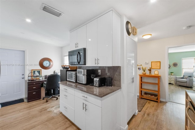 9909 NW 52nd Ln, Doral, FL 33178 - kitchen featuring black microwave, light wood-style flooring, an office area, and white cabinets