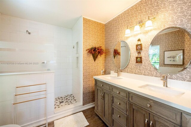 9909 NW 52nd Ln, Doral, FL 33178 - full bath featuring double vanity, wallpapered walls, a walk in shower, wood finished floors, and crown molding