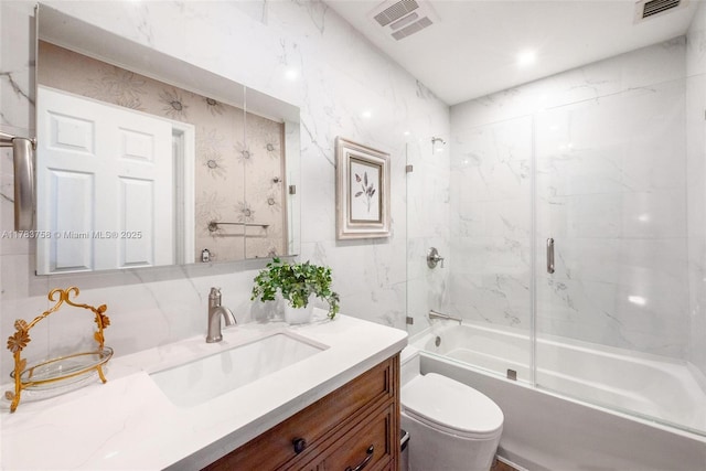 9909 NW 52nd Ln, Doral, FL 33178 - full bathroom featuring vanity, combined bath / shower with glass door, and toilet