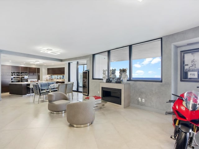 18555 Collins Ave Unit 5505, Sunny Isles Beach, FL 33160 - living room with healthy amount of natural light, wine cooler, and a fireplace