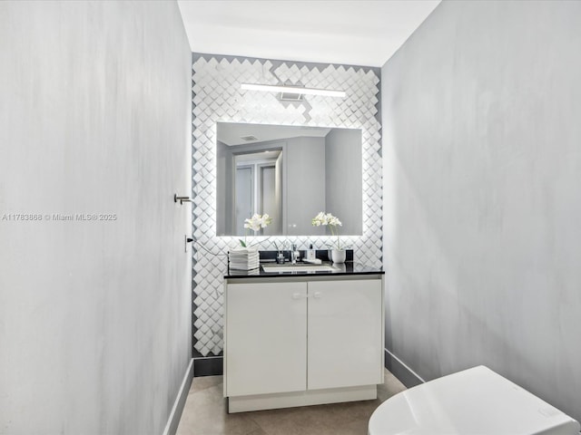 18555 Collins Ave Unit 5505, Sunny Isles Beach, FL 33160 - bathroom featuring tile walls, vanity, tasteful backsplash, and baseboards